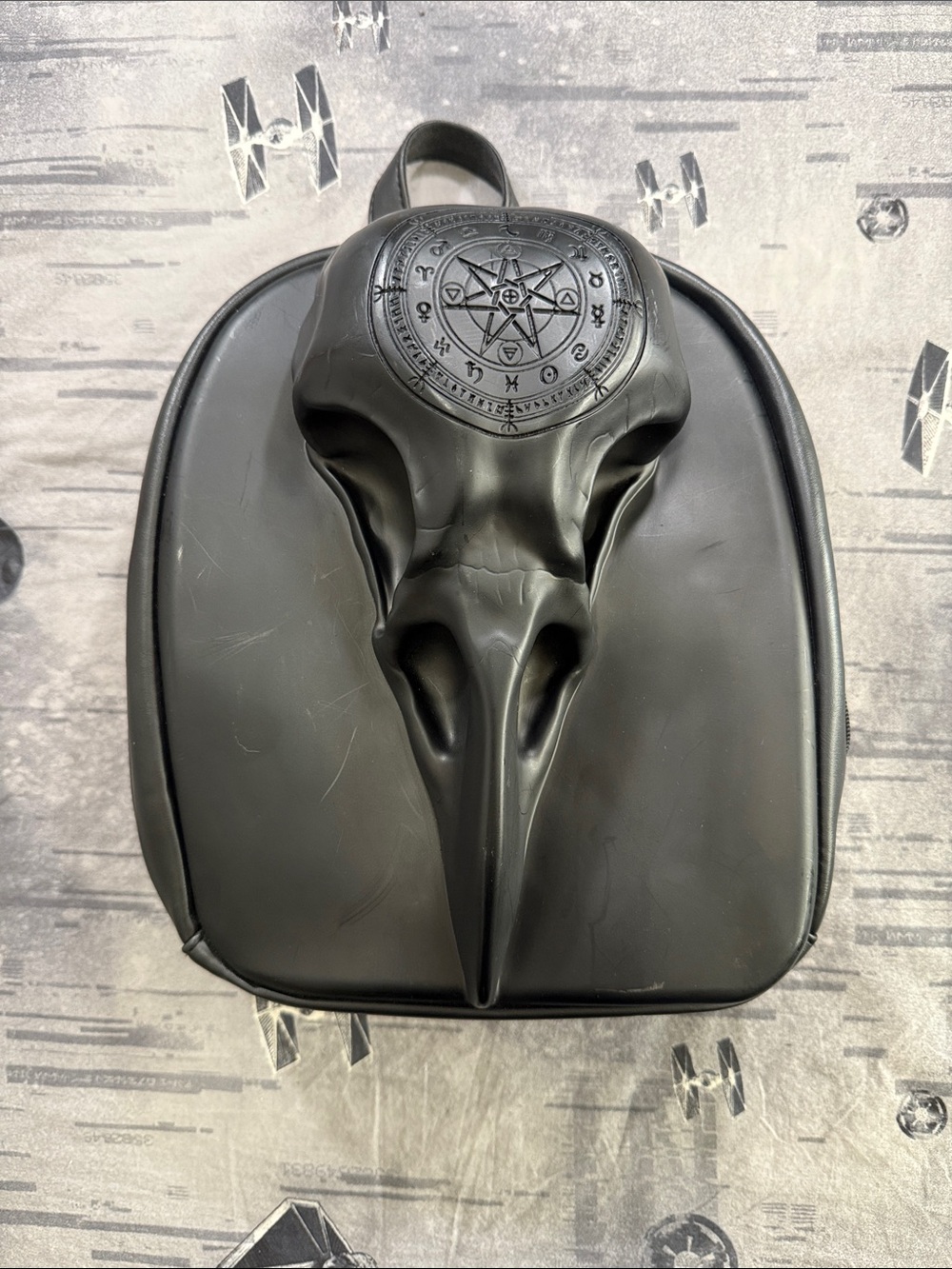 OCCULT RAVEN SKULL HARD CASE MINI BACKPACK FROM SPENCERS